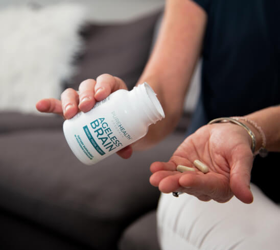 Ageless Brain product in hand