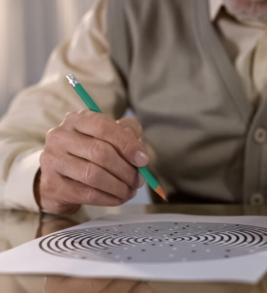 Person holding pencil