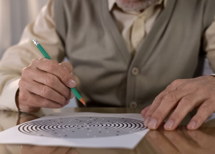 Person holding pencil